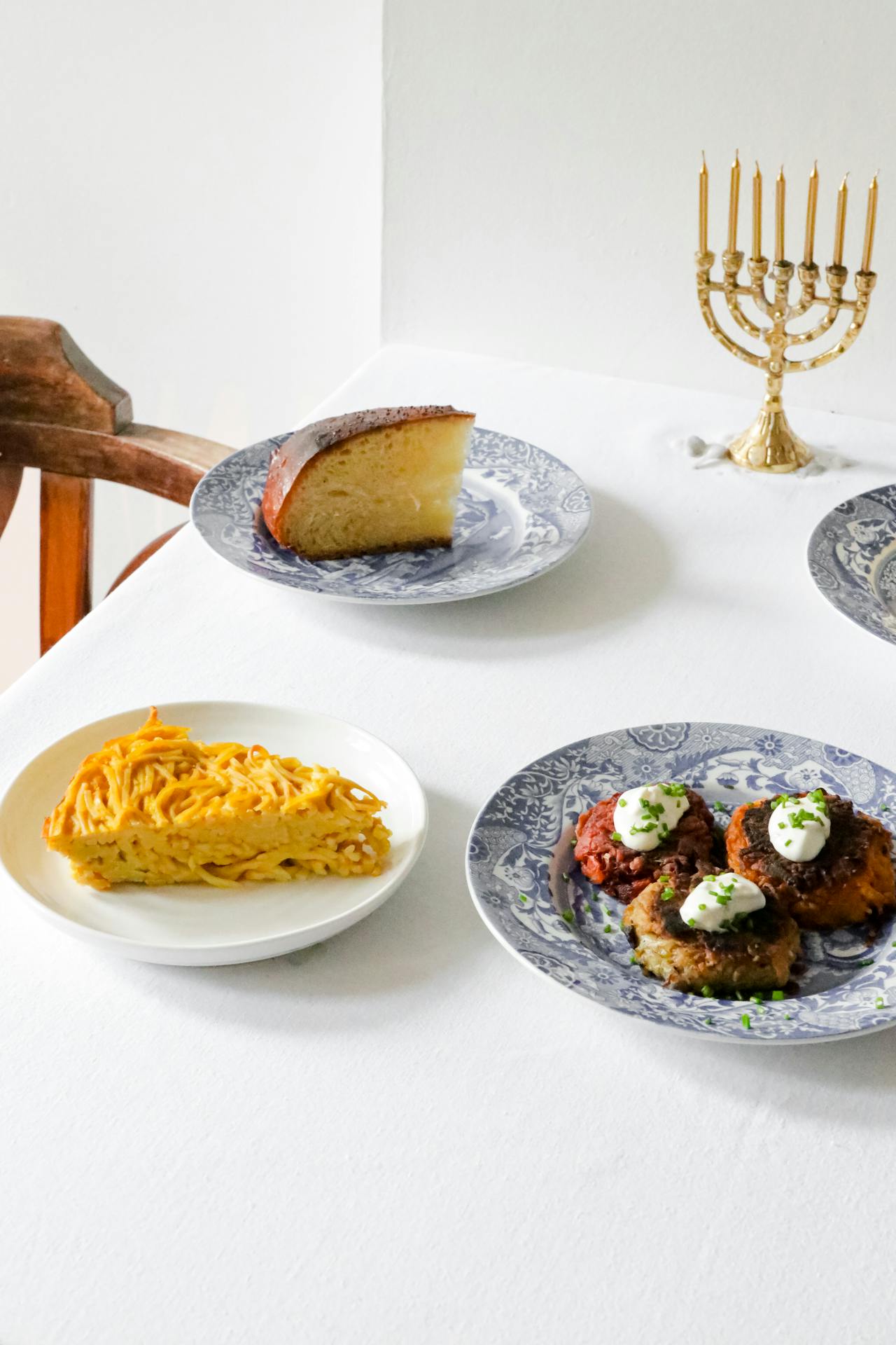 Kosher meal with menorah and seven candles, symbolizing Jewish traditions.